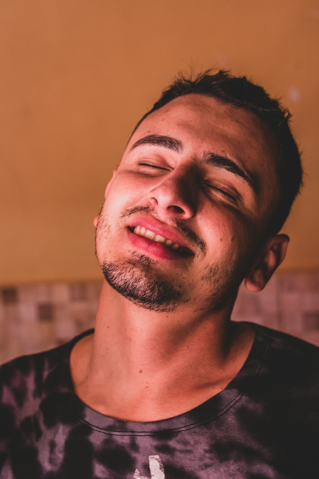 Studio portrait of a young Brazilian man smiling