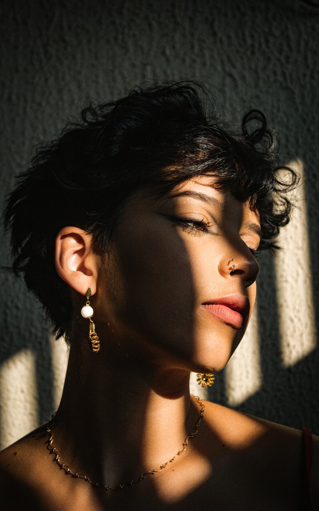 Studio portrait of a Brazilian woman with short hair