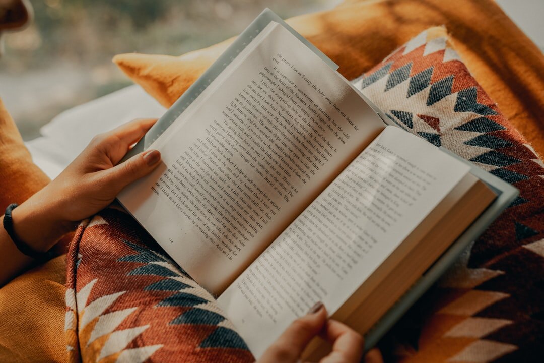 person reading self help book